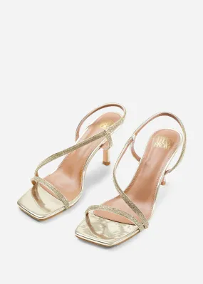 IVY CRYSTAL CROSS FOOT STRAP MID HEELS IN GOLD METALLIC
